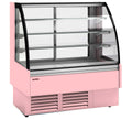 Vitrina semimural refrigerada Insignia VV-C con cristal curvo para bebidas, snacks, productos frescos y platos preparados.